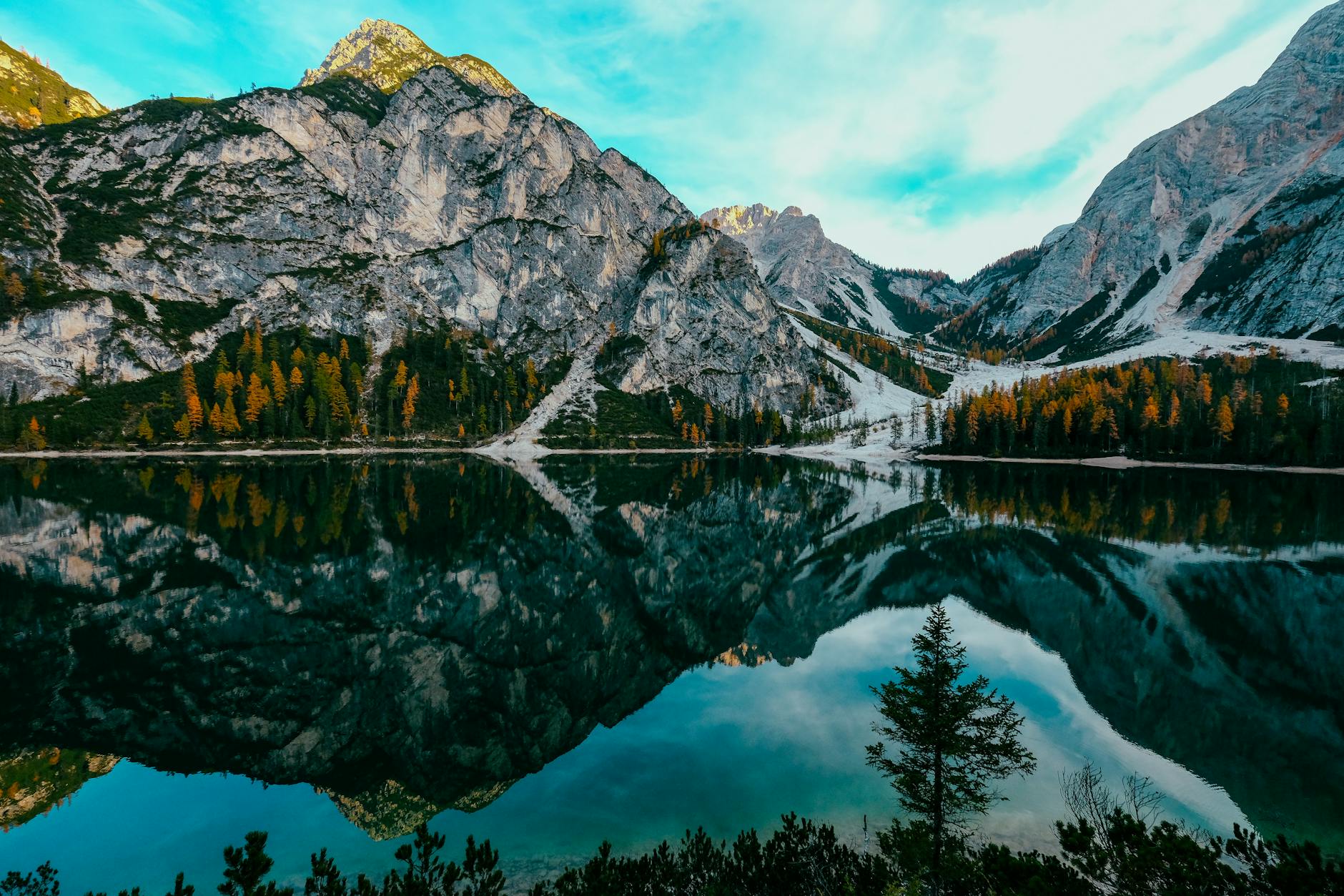 reflection of mountain on lake braies